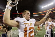 ARLINGTON, TX - DECEMBER 5: Quarterback Colt McCoy #12 of the Texas Longhorns celebates after his teams 10-6 victory over the Nebraska Cornhuskers in the game at Cowboys Stadium on December 5, 2009 in Arlington, Texas. (Photo by Jamie Squire/Getty Images)