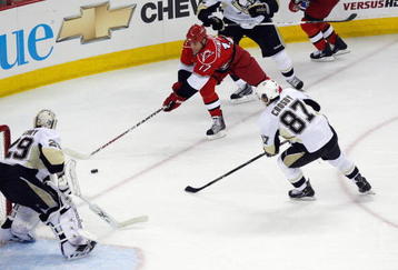 RALEIGH, NC - MAY 26:  Rod Brind'Amour #17 of the Carolina Hurricanes handles the puck against Sidney Crosby #87 and goalie Marc-Andre Fleury #29 of the Pittsburgh Penguins during Game Four of the Eastern Conference Championship Round of the 2009 Stanley Cup Playoffs at RBC Center on May 26, 2009 in Raleigh, North Carolina.   (Photo by Kevin C. Cox/Getty Images)