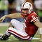 ARLINGTON, TX - DECEMBER 5: Quarterback Zac Lee of the Nebraska Cornhuskers reacts on the ground after being sacked in the first quarter against the Texas Longhorns at Cowboys Stadium on December 5, 2009 in Arlington, Texas.  (Photo by Jamie Squire/Getty Images)