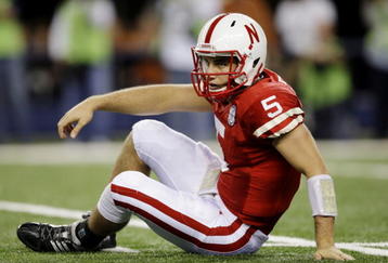 ARLINGTON, TX - DECEMBER 5: Quarterback Zac Lee of the Nebraska Cornhuskers reacts on the ground after being sacked in the first quarter against the Texas Longhorns at Cowboys Stadium on December 5, 2009 in Arlington, Texas.  (Photo by Jamie Squire/Getty Images)