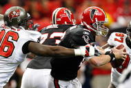 ATLANTA - NOVEMBER 29:  Matt Ryan #2 of the Atlanta Falcons is sacked by Tim Crowder #96 of the Tampa Bay Buccaneers at Georgia Dome on November 29, 2009 in Atlanta, Georgia.  (Photo by Kevin C. Cox/Getty Images)