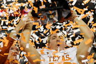 ARLINGTON, TX - DECEMBER 5: Quarterback Colt McCoy #12 of the Texas Longhorns lifts the trophy with head coach Mack Brown after their teams 10-6 victory over the Nebraska Cornhuskers in the game at Cowboys Stadium on December 5, 2009 in Arlington, Texas. (Photo by Ronald Martinez/Getty Images)