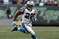 EAST RUTHERFORD, NJ - NOVEMBER 29:  Jonathan Stewart #28 of the Carolina Panthers runs the ball against the New York Jets on November 29, 2009 at Giants Stadium in East Rutherford, New Jersey. The Jets defeated the Panthers 17-6.  (Photo by Jim McIsaac/Getty Images)