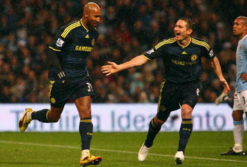 MANCHESTER, ENGLAND - DECEMBER 05:  Nicolas Anelka (L) of Chelsea celebrates with team mate Frank Lampard after Emmanuel Adebayor of Manchester City scored an own goal during the Barclays Premier League match between Manchester City and Chelsea at the City of Manchester Stadium on December 5, 2009 in Manchester, England. (Photo by Alex Livesey/Getty Images)