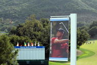 THOUSAND OAKS, CA - DECEMBER 01:  A sign of Tiger Woods overlooks the 18th green during preview for the Chevron World Challenge at Sherwood Country Club on December 1, 2009 in Thousand Oaks, California.  Woods withdrew from the tournament.  (Photo by Harry How/Getty Images)