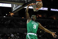SAN ANTONIO - DECEMBER 03:  Guard Rajon Rondo #9 of the Boston Celtics makes the slam dunk against the San Antonio Spurs on December 3, 2009 at AT&T Center in San Antonio, Texas.  NOTE TO USER: User expressly acknowledges and agrees that, by downloading and/or using this Photograph, user is consenting to the terms and conditions of the Getty Images License Agreement.  (Photo by Ronald Martinez/Getty Images)