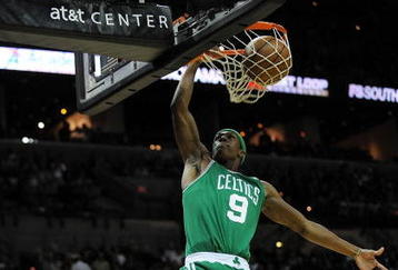 SAN ANTONIO - DECEMBER 03:  Guard Rajon Rondo #9 of the Boston Celtics makes the slam dunk against the San Antonio Spurs on December 3, 2009 at AT&T Center in San Antonio, Texas.  NOTE TO USER: User expressly acknowledges and agrees that, by downloading and/or using this Photograph, user is consenting to the terms and conditions of the Getty Images License Agreement.  (Photo by Ronald Martinez/Getty Images)