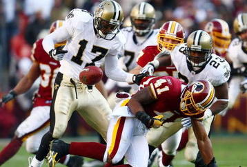 LANDOVER, MD - DECEMBER 06:  Robert Meachem #17 of the New Orleans Saints catches a fumble by Kareem Moore #41of the Washington Redskins on December 6, 2009 at FedExField in Landover, Maryland.  (Photo by Chris McGrath/Getty Images)