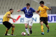 ATHENS, GREECE - DECEMBER 2: Geraldo (L) and Leonardo of AEK Athens compete with Seamus Coleman of Everton during the Europa League Match between AEK Athens and Everton at Spyros Louis Stadium, December 2, 2009 in Athens, Greece. (Photo by Milos Bicanski/Getty Images)