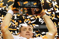 ARLINGTON, TX - DECEMBER 5: Quarterback Colt McCoy #12 of the Texas Longhorns lifts the trophy after his teams 10-6 victory over the Nebraska Cornhuskers in the game at Cowboys Stadium on December 5, 2009 in Arlington, Texas. (Photo by Ronald Martinez/Getty Images)