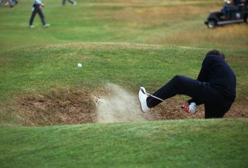 Spanish golfer Seve Ballesteros attempts an unusual bunker shot during practice for the Open Championship at the Royal Birkdale Golf Club, Southport, 1998. (Photo by Stephen Munday/Getty Images)