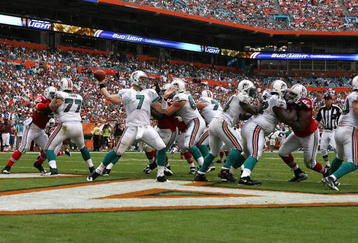 MIAMI - DECEMBER 06:  Quarterback Chad Henne #7 of the Miami Dolphins throws out of his own end-zone while taking on the New England Patriots at Land Shark Stadium on December 6, 2009 in Miami, Florida. The Dolphins defeated the Patriots 22-21.  (Photo by Doug Benc/Getty Images)