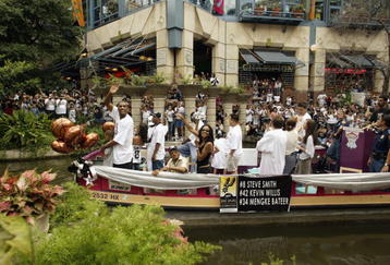SAN ANTONIO - JUNE 18:  Steve Smith #8 (front of boat) of the San Antonio Spurs celebrates during the SBC 2003 Spurs Championship Celebration on June 18, 2003 at the Riverwalk in San Antonio, Texas.  NOTE TO USER: User expressly acknowledges and agrees that, by downloading and/or using this Photograph, User is consenting to the terms and conditions of the Getty Images License Agreement.  (Photo by Ronald Martinez/Getty Images)