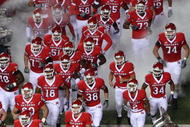 PISCATAWAY, NJ - NOVEMBER 12: The Rutgers Scarlet Knights take the field to play against the South Florida Bulls at Rutgers Stadium on November 12, 2009 in Piscataway, New Jersey. (Photo by Jim McIsaac/Getty Images)