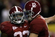 ATLANTA - DECEMBER 5:  (L-R) Mark Ingram #22 and quarterback Greg McElroy #12 of the Alabama Crimson Tide celebrate after Ingram scored a 1-yard touchdown in the fourth quarter against the Florida Gators during the SEC Championship game at Georgia Dome on December 5, 2009 in Atlanta, Georgia.  (Photo by Kevin C. Cox/Getty Images)