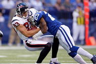 INDIANAPOLIS - NOVEMBER 8: Kevin Walter #83 of the Houston Texans runs with the ball while tackled by Jerraud Powers #25 of the Indianapolis Colts during the NFL game at Lucas Oil Stadium on November 8, 2009 in Indianapolis, Indiana. The Colts defeated the Texans 20-17. (Photo by Andy Lyons/Getty Images)