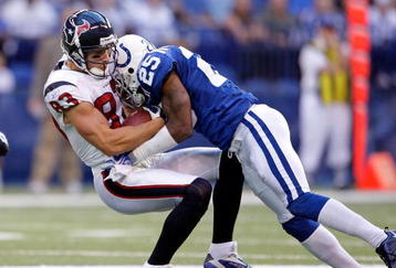 INDIANAPOLIS - NOVEMBER 8:  Kevin Walter #83 of the  Houston Texans runs with the ball while tackled by Jerraud Powers #25 of the Indianapolis Colts during the NFL game at Lucas Oil Stadium on November 8, 2009 in Indianapolis, Indiana.  The Colts defeated the Texans 20-17.  (Photo by Andy Lyons/Getty Images)