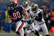 CHICAGO - DECEMBER 06:  Earl Bennett #80 of the Chicago Bears breaks for a long run and is chased by (L-R) Craig Dahl #43 and Oshiomogho Atogwe of the St. Louis Rams at Soldier Field on December 6, 2009 in Chicago, Illinois. The Bears defeated the Rams 17-9.  (Photo by Jonathan Daniel/Getty Images)