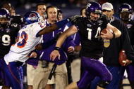 SAN DIEGO, CA - DECEMBER 23:  Quarterback Andy Dalton #14 of  TCU runs with the ball against the tackle of Safety Jeron Johnson #23 of Boise State during the San Diego County Credit Union Poinsettia Bowl at Qualcomm Stadium on December 23, 2008 in San Diego, California. (Photo by Donald Miralle/Getty Images)
