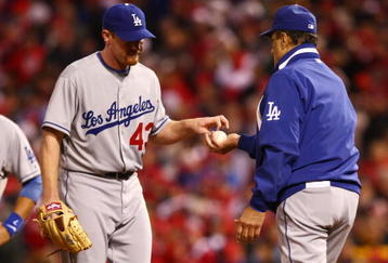 PHILADELPHIA - OCTOBER 19:  Starting pitcher Randy Wolf #43 of the Los Angeles Dodgers is taken out of the game by manager Joe Torre #6 in the bottom of the sixth inning against of the Philadelphia Phillies in Game Four of the NLCS during the 2009 MLB Playoffs at Citizens Bank Park on October 19, 2009 in Philadelphia, Pennsylvania.  (Photo by Chris McGrath/Getty Images)