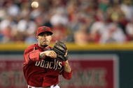 PHOENIX - JUNE 28:  Infielder Felipe Lopez #2 of the Arizona Diamondbacks throws over the sliding Bobby Abreu #53 of the Los Angeles Angels of Anaheim attempting a double play during the seventh inning of the major league baseball game at Chase Field on June 28, 2009 in Phoenix, Arizona.  (Photo by Christian Petersen/Getty Images)