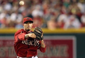 PHOENIX - JUNE 28:  Infielder Felipe Lopez #2 of the Arizona Diamondbacks throws over the sliding Bobby Abreu #53 of the Los Angeles Angels of Anaheim attempting a double play during the seventh inning of the major league baseball game at Chase Field on June 28, 2009 in Phoenix, Arizona.  (Photo by Christian Petersen/Getty Images)