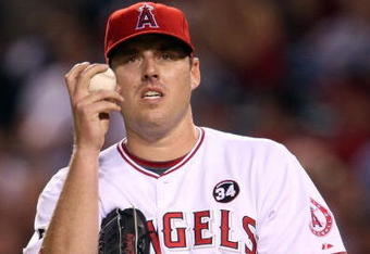 ANAHEIM, CA - OCTOBER 22:  John Lackey #41 of the Los Angeles Angels of Anaheim reacts in Game Five of the ALCS against the New York Yankees during the 2009 MLB Playoffs at Angel Stadium on October 22, 2009 in Anaheim, California.  (Photo by Stephen Dunn/Getty Images)