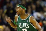 OAKLAND, CA - DECEMBER 29:  Walter McCarty #0 of the Boston Celtics runs down the court and celebrates during the game against the Golden State Warriors at the Arena in Oakland on December 29, 2003 in Oakland, California.  The Celtics won 100-91.  NOTE TO USER: User expressly acknowledges and agrees that, by downloading and/or using this Photograph, User is consenting to the terms and conditions of the Getty Images License Agreement.(Photo by: Jed Jacobsohn/Getty Images)