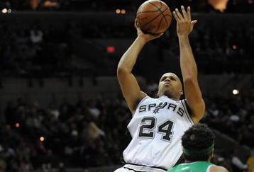 SAN ANTONIO - DECEMBER 03:  Forward Richard Jefferson #24 of the San Antonio Spurs takes a shot against Rasheed Wallace #30 of the Boston Celtics on December 3, 2009 at AT&T Center in San Antonio, Texas.  NOTE TO USER: User expressly acknowledges and agrees that, by downloading and/or using this Photograph, user is consenting to the terms and conditions of the Getty Images License Agreement.  (Photo by Ronald Martinez/Getty Images)
