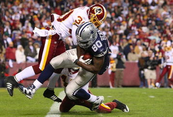 LANDOVER, MD - NOVEMBER 16:  Martellus Bennett #80 of the Dallas Cowboys scores a touchdown in the fourth quarter against LaRon Landry #30 of the Washington Redskins during the game on November 16, 2008 at FedEx Field in Landover, Maryland.  (Photo by Jim McIsaac/Getty Images)