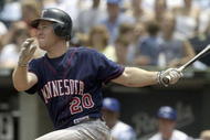 KANSAS CITY, MO - JULY 17:  Lew Ford #20 of the Minnesota Twins watches his hit turn into a two-run homer in the sixth against starting pitcher Jimmy Gobble #41 of the Kansas City Royals July 17, 2004 at Kauffman Stadium in Kansas City, Missouri. (Photo by Dave Kaup/Getty Images)