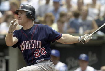 KANSAS CITY, MO - JULY 17:  Lew Ford #20 of the Minnesota Twins watches his hit turn into a two-run homer in the sixth against starting pitcher Jimmy Gobble #41 of the Kansas City Royals July 17, 2004 at Kauffman Stadium in Kansas City, Missouri. (Photo by Dave Kaup/Getty Images)