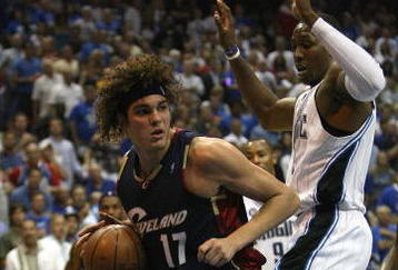 ORLANDO, FL - MAY 30:  Anderson Varejao #17 of the Cleveland Cavaliers handles the ball against Dwight Howard #12 of the Orlando Magic in Game Six of the Eastern Conference Finals during the 2009 Playoffs at Amway Arena on May 30, 2009 in Orlando, Florida. NOTE TO USER: User expressly acknowledges and agrees that, by downloading and or using this photograph, User is consenting to the terms and conditions of the Getty Images License Agreement  (Photo by Elsa/Getty Images)
