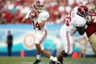 JACKSONVILLE, FL - SEPTEMBER 29: Quarterback John Parker Wilson #4 of the University of Alabama rolls out against the Florida State University September 29, 2007 at Jacksonville Municipal Stadium in Jacksonville, Florida. (Photo by Marc Serota/Getty Images) 