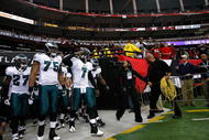 ATLANTA - DECEMBER 06:  Michael Vick #7 of the Philadelphia Eagles leads the team onto the field to face the Atlanta Falcons at Georgia Dome on December 6, 2009 in Atlanta, Georgia.  (Photo by Kevin C. Cox/Getty Images)