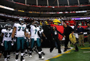 ATLANTA - DECEMBER 06:  Michael Vick #7 of the Philadelphia Eagles leads the team onto the field to face the Atlanta Falcons at Georgia Dome on December 6, 2009 in Atlanta, Georgia.  (Photo by Kevin C. Cox/Getty Images)