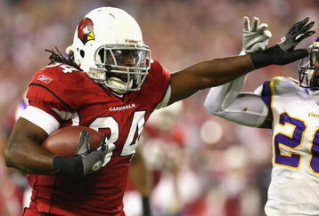 GLENDALE, AZ - DECEMBER 06:  Runningback Tim Hightower #34 of the Arizona Cardinals rushes the ball against Madieu Williams #20 of the Minnesota Vikings during the NFL game at the Universtity of Phoenix Stadium on December 6, 2009 in Glendale, Arizona. The Cardinals defeated the Vikings 30-17.  (Photo by Christian Petersen/Getty Images)
