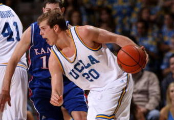 WESTWOOD, CA - DECEMBER 6:  Michael Roll #20 of the UCLA Bruins drives against the Kansas Jayhawks on December 6, 2009 at Pauley Pavillion in Westwood, California.  Kansas won 73-61.   (Photo by Stephen Dunn/Getty Images)