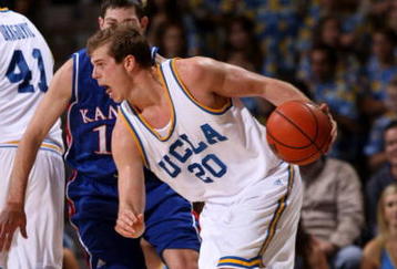 WESTWOOD, CA - DECEMBER 6:  Michael Roll #20 of the UCLA Bruins drives against the Kansas Jayhawks on December 6, 2009 at Pauley Pavillion in Westwood, California.  Kansas won 73-61.   (Photo by Stephen Dunn/Getty Images)