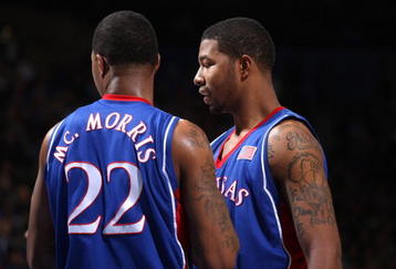 WESTWOOD, CA - DECEMBER 6:   Markieff Morris #21 and Marcus Morris #22 of the Kansas Jayhawks confer during the game with the UCLA Bruins on December 6, 2009 at Pauley Pavillion in Westwood, California.  Kansas won 73-61.   (Photo by Stephen Dunn/Getty Images)