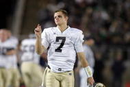 PALO ALTO, CA - NOVEMBER 28:  Jimmy Clausen #7 of the Notre Dame Fighting Irish walks the sidelines during their game against the Stanford Cardinal at Stanford Stadium on November 28, 2009 in Palo Alto, California.  (Photo by Ezra Shaw/Getty Images)