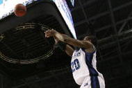TAMPA, FL - MARCH 21: Josh Young #20 of the Drake Bulldogs goes up for a shot over Boris Siakam #21 of the Western Kentucky Hilltoppers during the first round of the 2008 NCAA Tournament West Regional at the St. Pete Times Forum on March 21, 2008 in Tampa, Florida. (Photo by Doug Benc/Getty Images)