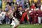 14 Nov 1998:  Inside lineback Dat Nguyen #9 of the Texas A&M Aggies celebrates during a game against the Missouri Tigers at Kyle Field in College Station, Texas. The Aggies defeated the Tigers 17-14. Mandatory Credit: Stephen Dunn  /Allsport