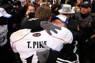 PITTSBURGH - DECEMBER 05: Tony Pike #15 is congratulated by head coach Brian Kelly of the Cincinnati Bearcats following their win against the University of Pittsburgh Panthers on December 5, 2009 at Heinz Field in Pittsburgh, Pennsylvania.  (Photo by Jared Wickerham/Getty Images)