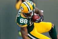 GREEN BAY, WI - NOVEMBER 22: Tight end Jermichael Finley #88 of the Green Bay Packers dives for additional yardage after a pass reception against the San Francisco 49ers at Lambeau Field on November 22, 2009 in Green Bay, Wisconsin. The Packers defeated the 49ers 30-24. (Photo by Scott Boehm/Getty Images)