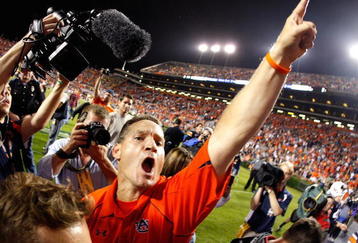 AUBURN, AL - SEPTEMBER 19:  Head coach Gene Chizik of the Auburn Tigers celebrates their 41-30 win over the West Virginia Mountaineers at Jordan-Hare Stadium on September 19, 2009 in Auburn, Alabama.  (Photo by Kevin C. Cox/Getty Images)