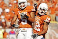 AUSTIN, TX - NOVEMBER 07:  Safeties Ben Wells #5 and Earl Thomas #12 of the Texas Longhorns celebrate after stuffing the UCF Knights on November 7, 2009 at Darrell K Royal - Texas Memorial Stadium in Austin, Texas.  Texas won 35-3.  (Photo by Brian Bahr/Getty Images)