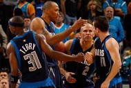NEW ORLEANS - NOVEMBER 04: Jason Terry #31, Shawn Marion #0, Jason Kidd #2 congratulate Jose Barea #11 of the Dallas Mavericks during the game against the New Orleans Hornets at New Orleans Arena on November 4, 2009 in New Orleans, Louisiana. NOTE TO USER: User expressly acknowledges and agrees that, by downloading and or using this photograph, User is consenting to the terms and conditions of the Getty Images License Agreement. (Photo by Chris Graythen/Getty Images)