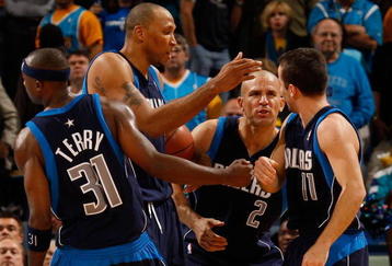 NEW ORLEANS - NOVEMBER 04:  Jason Terry #31, Shawn Marion #0, Jason Kidd #2  congratulate Jose Barea #11 of the Dallas Mavericks during the game against the New Orleans Hornets at New Orleans Arena on November 4, 2009 in New Orleans, Louisiana.  NOTE TO USER: User expressly acknowledges and agrees that, by downloading and or using this photograph, User is consenting to the terms and conditions of the Getty Images License Agreement.  (Photo by Chris Graythen/Getty Images)