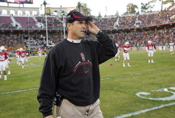 PALO ALTO, CA - NOVEMBER 21:  Head Coach Jim Harbaugh of the Stanford Cardinal watches his team warmup before their game against the California Bears at Stanford Stadium on November 21, 2009 in Palo Alto, California.  (Photo by Ezra Shaw/Getty Images)